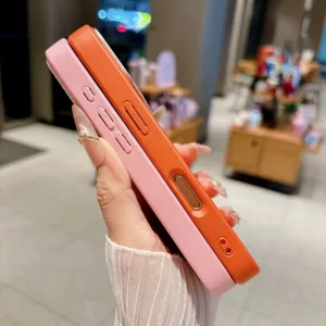 Side detail view of vibrant pink and orange protective phone cases with precise buttons.