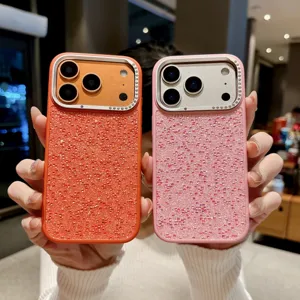 Detailed view of luxury rhinestone glitter phone cases in orange and pink, compatible with iPhone.