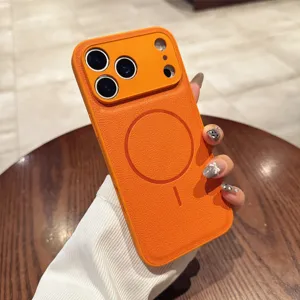Orange plain leather MagSafe phone case with camera lens protection for iPhone, sleek finish.
