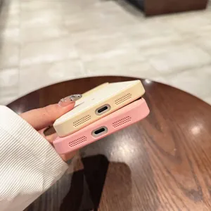Close-up of precise cutouts and speaker holes on stylish solid color leather phone case.
