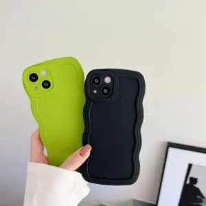 Detailed view of trendy liquid silicone wavy phone cases in vibrant green and classic black.
