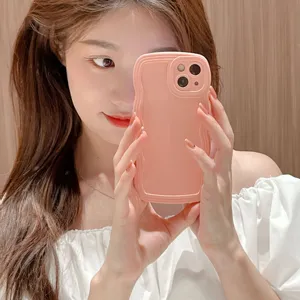 Pink liquid silicone wavy phone case detail, anti-drop grip frame, smooth texture.