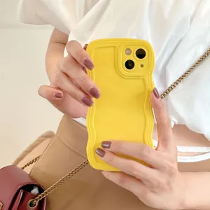 Detailed view of the yellow liquid silicone wavy phone case showing smooth texture and grip.