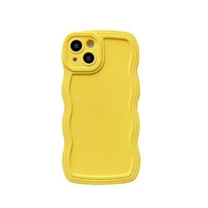 Bright yellow liquid silicone phone case with trendy wavy edge design and camera protection.