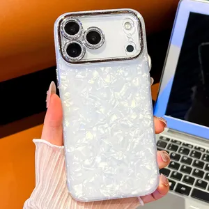 Luxury white shell pattern phone case with electroplated diamond camera protector for iPhone.