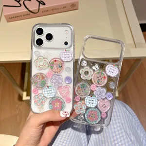 Clear phone case decorated with cute buttons, flowers, and glitter for iPhone series.