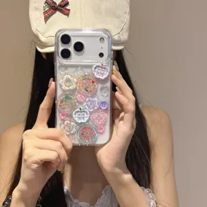 Clear TPU phone case with cute resin buttons, flowers and glitter for iPhone models.