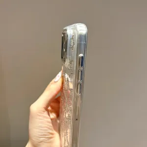 Close up of clear rhinestone clover phone case detail showing sparkling crystal pattern side view.