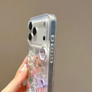 Close-up detail of transparent phone case featuring cute 3D flower and button charms design.