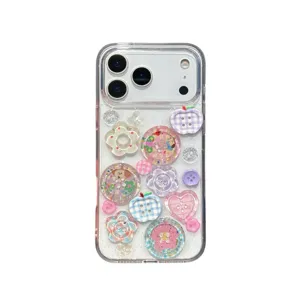 Clear glitter phone case with cute colorful buttons, flowers and hearts for iPhone models.