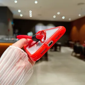 Red phone case detail view, showing charging port and lanyard attachment style.