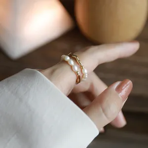 Pearl elastic ring detail shot, showing delicate beaded double layer design for chic finger wear.