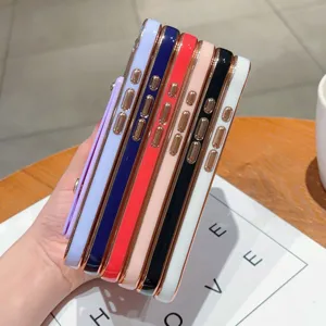 Detailed view of colorful electroplated phone cases with acrylic wrist strap stand for iPhone.