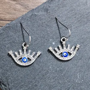 Stunning rhinestone evil eye earrings featuring a stylish blue and white design for women.