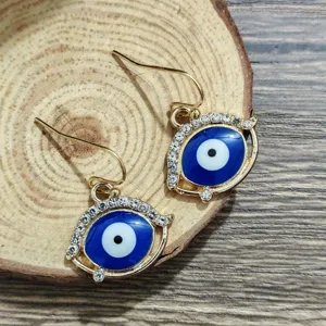 Detailed view of fashionable evil eye rhinestone earrings with gold tone hook design and chic style.