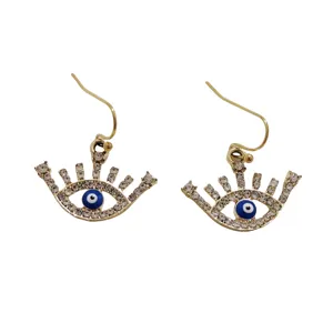 Gold evil eye hook earrings with sparkling rhinestones and blue center for stylish women.