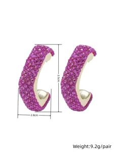 Stunning purple crystal paved C-shaped hoop earrings, elegant geometric design for women.