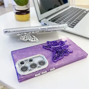 Close-up detail of purple marble butterfly stand phone case featuring integrated camera lens protector.