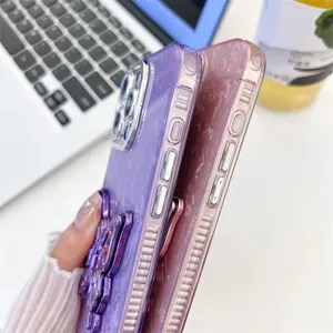 Detail shot of marble texture iPhone phone case featuring a stylish purple butterfly ring stand.