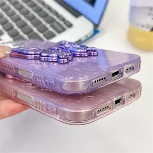 Close-up detail of purple and pink marble texture iPhone cases with cute butterfly stand.