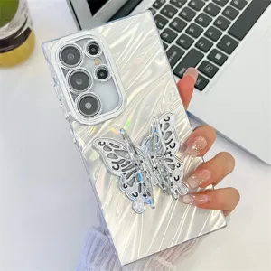 Closeup of silver water ripple phone case with butterfly ring stand and camera protection.