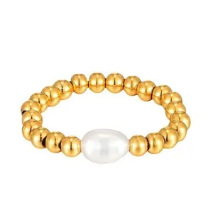 Elegant 14K gold plated beaded ring featuring a natural freshwater pearl elastic band.