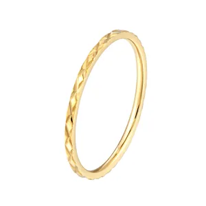 Close-up detail of the stylish quilted diamond pattern gold-plated stainless steel ring.