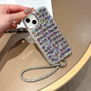 Coque strass scintillante iPhone 16 Pro Max avec dragonne luxueuse et cadre électroplaqué.