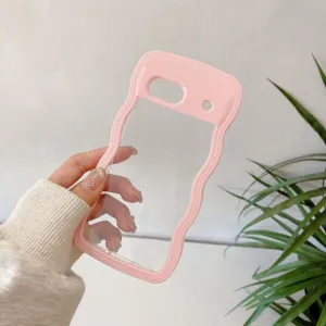 Detailed shot of a wavy clear phone case with pink bumper, held by hand showcasing design.