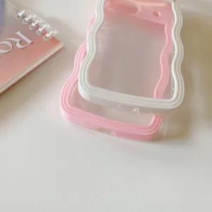 Closeup of wavy phone cases in pink and white, transparent PC design, sleek and stylish look.