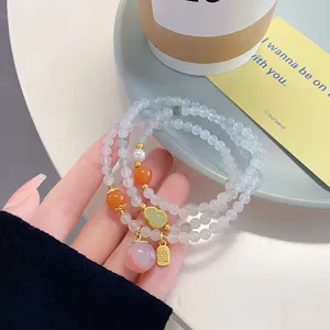 Chinese style multi-layer Tianshan jade bead bracelet with cute peach and gourd pendants.