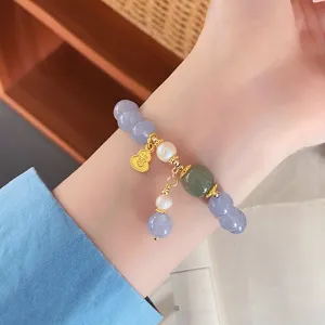 Delicate natural stone beaded bracelet with pearls and cute gold pendant for daily sweet style.