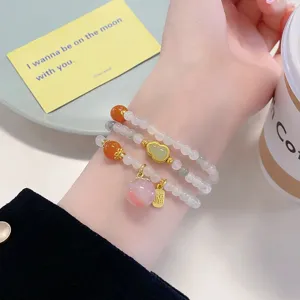 Chinese style multi-layer natural stone beaded bracelet with peach and gourd charms.