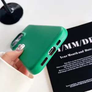 Green plain leather iPhone case detail view, full coverage protective phone cover for Apple.