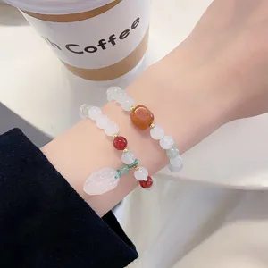 Elegant Chinese style double layer jade beaded bracelet with charming leaf pendant detail.