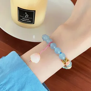 Charming blue natural stone bead bracelet with cute cat paw pendant, sweet aesthetic jewelry.