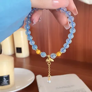 Light blue natural stone beaded bracelet with gold mermaid tail pendant and sweet fairy style