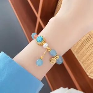 Exquisite natural stone and pearl bracelet featuring a cute design and auspicious charm.