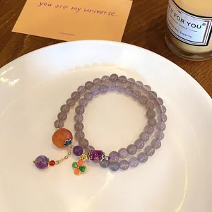 Detailed view of the multi-layer natural agate beaded bracelet featuring unique colorful gemstone pendants.