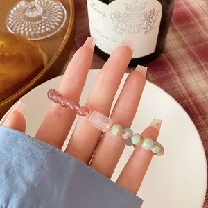Sweet fresh style beaded bracelet with strawberry and rose quartz natural stones detail view.