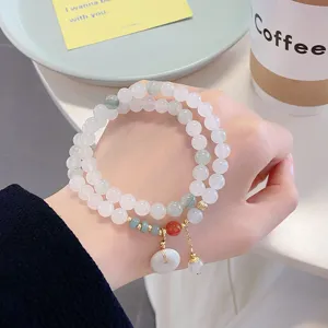 Chinese style double layer jade stone beaded bracelet detail with cute peace buckle pendant.