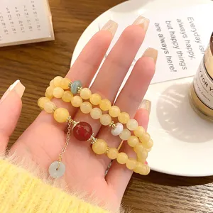 Detailed view of the Chinese style natural agate double layer golden silk jade safety bracelet.