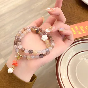Elegant natural agate multi-layer beaded bracelet with floral pendant for women daily wear.
