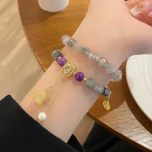 Exquisite multi-layer gemstone bracelet detail showcasing natural agate and jade charm.