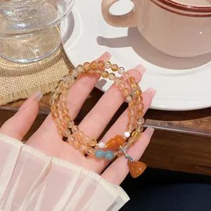 Bracelet double en cristal de citrine avec pendentifs gourde et lotus, rétro chic.