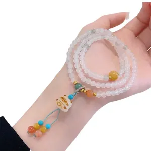 Elegant multi-layer crystal bead bracelet with cute lucky cat pendant for women fashion.