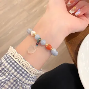 Fresh blue natural stone beaded bracelet detail shot, sweet fairy style charm for daily wear.