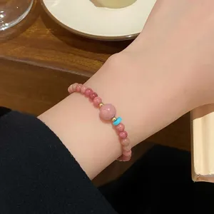Charming pink gemstone beaded bracelet for women, sweet minimalist design with chic charm details.