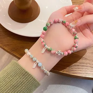 Sweet natural stone beaded bracelet set with clover charm for women elegant wrist jewelry.