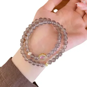 Elegant double-layer natural agate beaded bracelet for women featuring chic design and charms.